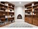 Cozy library with built-in bookshelves and a fireplace, perfect for reading and relaxing at 9 Polo Field Ln, Denver, CO 80209