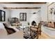 Cozy living room with a fireplace, comfortable seating, and a unique Southwestern-style decor at 9 Polo Field Ln, Denver, CO 80209