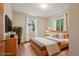 Cozy bedroom with two windows and neutral decor at 4072 Ames St, Wheat Ridge, CO 80212