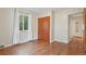 A well-lit bedroom with hardwood floors, a large window and closet is ideal at 4072 Ames St, Wheat Ridge, CO 80212