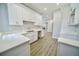 Renovated kitchen with white cabinets and quartz countertops at 436 Cherokee St, Denver, CO 80204
