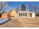 The home's exterior has a large, fenced backyard and a closed-in patio with large windows at 3164 Scranton St, Aurora, CO 80011