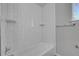 Full bathroom with white tiled shower and tub at 3164 Scranton St, Aurora, CO 80011