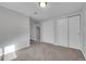 This spacious bedroom is complete with an entry door and large closets with sliding doors at 3164 Scranton St, Aurora, CO 80011