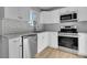 Bright kitchen featuring white cabinets, stainless steel appliances, subway tile backsplash and granite countertops at 3164 Scranton St, Aurora, CO 80011