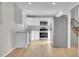 Modern kitchen featuring stainless steel appliances, white cabinets, and granite countertops at 3164 Scranton St, Aurora, CO 80011