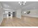 Open floor plan with spacious living area and modern kitchen featuring new appliances at 3164 Scranton St, Aurora, CO 80011