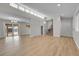 Spacious open-concept living area with hardwood floors and recessed lighting at 3164 Scranton St, Aurora, CO 80011
