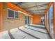 This covered patio has a corrugated metal awning, brick accents and plenty of room for outdoor furniture at 3164 Scranton St, Aurora, CO 80011