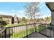 Peaceful balcony view overlooking green spaces and surrounding buildings on a clear day at 8751 Pearl St # D1, Thornton, CO 80229
