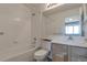 Clean bathroom features a bathtub and shower combination with neutral ceramic tile at 8751 Pearl St # D1, Thornton, CO 80229