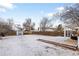 Spacious backyard featuring a wooden deck, storage shed, and privacy fence, perfect for outdoor activities at 1777 Spruce St, Denver, CO 80220