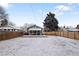 Beautiful backyard featuring a wooden deck with outdoor seating and a mature tree offering shade at 1777 Spruce St, Denver, CO 80220