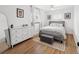 Cozy bedroom featuring hardwood floors, soft lighting, and a comfortable bed at 1777 Spruce St, Denver, CO 80220