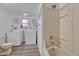 Bathroom includes a tub with a shower and a washer-dryer set at 1567 S Sedalia St, Aurora, CO 80017