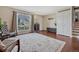 Bright living room with wood floors, a large window and neutral walls at 1567 S Sedalia St, Aurora, CO 80017