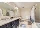 Bathroom featuring double sink vanity and tiled floor at 7220 W Bonfils Ln # 206, Lakewood, CO 80226