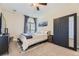 Cozy bedroom with a ceiling fan, window with blind and a wardrobe at 7220 W Bonfils Ln # 206, Lakewood, CO 80226