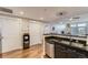 Modern kitchen with granite countertops, stainless steel appliances, and wood flooring at 7220 W Bonfils Ln # 206, Lakewood, CO 80226