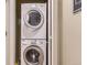 A stacked washer and dryer in a dedicated laundry area at 7220 W Bonfils Ln # 206, Lakewood, CO 80226