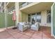 Comfortable outdoor patio setup with an umbrella for shade at 7220 W Bonfils Ln # 206, Lakewood, CO 80226