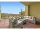A covered outdoor patio offers comfortable seating with a skyline view at 7220 W Bonfils Ln # 206, Lakewood, CO 80226