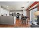 Modern kitchen featuring white cabinets, stainless steel appliances, and a dining area perfect for Gathering meals at 13884 Lilac St, Thornton, CO 80602