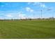 Large sports field with artificial turf and lighting, providing a great space for games and practice at 13884 Lilac St, Thornton, CO 80602