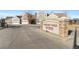 Stone sign reads 'Gateway Park Townhomes' with the address in a manicured landscape at 15555 E 40Th Ave # 6, Denver, CO 80239