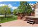 Spacious wooden deck featuring a hot tub and views of the backyard at 6213 S Galena Way, Englewood, CO 80111