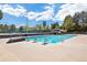 Community pool with diving blocks and clubhouse at 6213 S Galena Way, Englewood, CO 80111