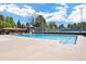 Large community pool and clubhouse with tennis courts in the background at 6213 S Galena Way, Englewood, CO 80111