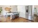Bright eat-in kitchen featuring stainless steel appliances, breakfast bar, and modern finishes at 6213 S Galena Way, Englewood, CO 80111