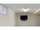 Cozy living room with a window and a wall-mounted television and sound bar at 6213 S Galena Way, Englewood, CO 80111