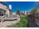 Spacious backyard with a deck, well-maintained lawn, and mature trees, perfect for outdoor entertaining at 12646 S Dove Creek Way, Parker, CO 80134