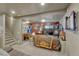 Finished basement with sports decor, TV and game table at 12646 S Dove Creek Way, Parker, CO 80134