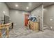 Finished basement with desks, lights, and light wood flooring at 12646 S Dove Creek Way, Parker, CO 80134