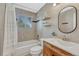 Charming bathroom with tiled walls, a shower-tub combination, and a wood vanity at 12646 S Dove Creek Way, Parker, CO 80134