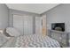 Cozy bedroom features closet and gray walls at 12646 S Dove Creek Way, Parker, CO 80134