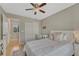 Comfortable bedroom featuring a desk, closet and soft natural light coming through the window at 12646 S Dove Creek Way, Parker, CO 80134