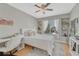 Bright bedroom with built-in shelves, large window, creating an inviting and functional living space at 12646 S Dove Creek Way, Parker, CO 80134