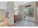 Charming breakfast bar featuring dark wood cabinets, tile floors, and open view to the breakfast nook, creating an inviting transition at 12646 S Dove Creek Way, Parker, CO 80134