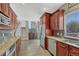 Gourmet kitchen is equipped with stainless steel appliances, granite counters and dark cabinets, seamlessly connecting style with functionality at 12646 S Dove Creek Way, Parker, CO 80134