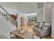 Spacious open floor plan with hardwood floors, comfortable seating, and seamless flow to the dining area at 12646 S Dove Creek Way, Parker, CO 80134