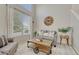 Cozy living room filled with natural light and featuring a large window and comfortable seating at 12646 S Dove Creek Way, Parker, CO 80134