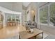 Bright living room boasts large windows, wood floors and is open to the dining area, creating a flowing, inviting space at 12646 S Dove Creek Way, Parker, CO 80134