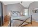 Comfortable main bedroom with a vaulted ceiling and an open view to the en-suite bathroom at 12646 S Dove Creek Way, Parker, CO 80134