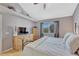 Cozy main bedroom with a vaulted ceiling, and a large window for ample natural light at 12646 S Dove Creek Way, Parker, CO 80134