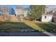 Spacious backyard with lush green lawn and a storage shed at 5956 S Winnipeg St, Aurora, CO 80015