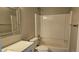 Modern bathroom featuring a shower-tub combo and clean finishes at 5956 S Winnipeg St, Aurora, CO 80015